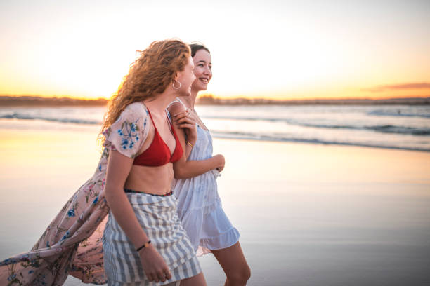 istock Friends walking on the beach 922658144