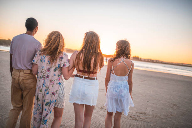istock Friends walking on the beach 922658154