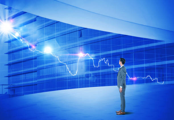 istock Businessman looking at bar graph on modern office window 922658416