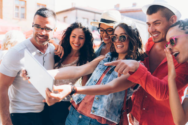 istock Group of young people taking selfie with tablet 922658436