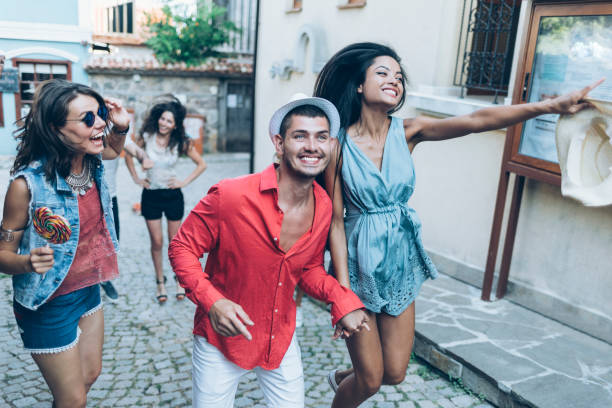 istock Happy young people running on street 922658438