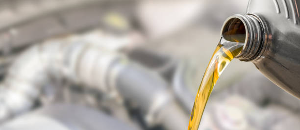 istock Motor oil pouring. 922658608