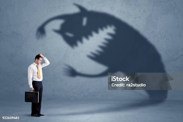 Business Man Afraid Of His Own Shadow Monster Concept Stock Photo - Download Image Now