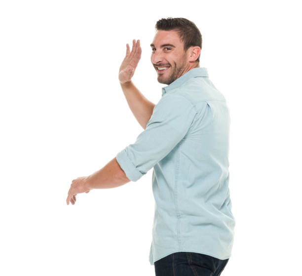 istock Charming man waist up waving hand 922659992