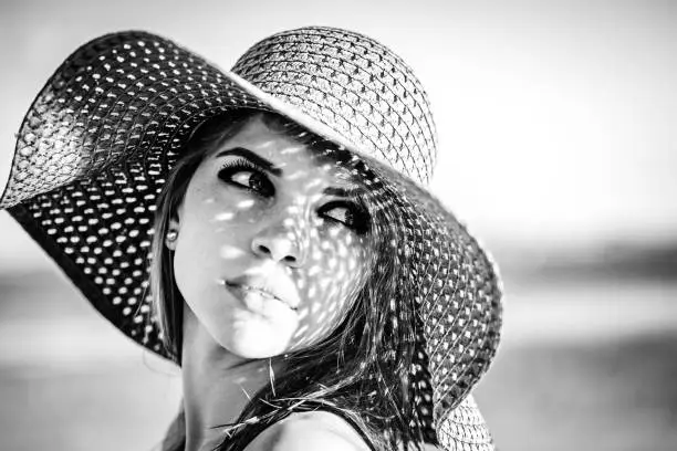 Photo of Sweet girl in a hat. Black and white photo.