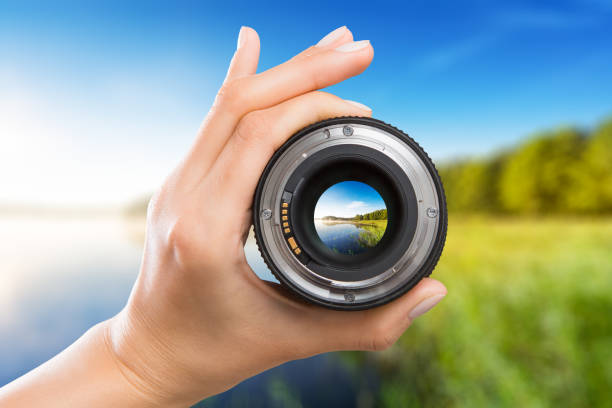 Photography camera lens concept. photography view camera photographer lens lense through video photo digital glass hand blurred focus people concept - stock image focus areas stock pictures, royalty-free photos & images