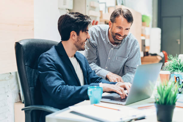 istock Smiling businessmen working in the office 922663538
