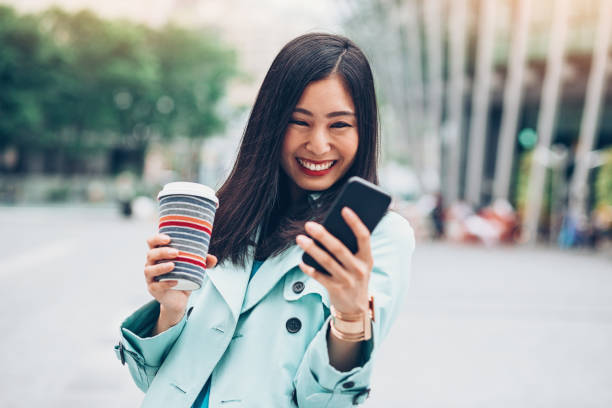 istock Young woman laughing at funny message 922663586