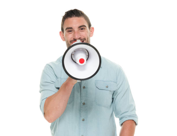 istock Charming man waist up holding a megaphone 922663650