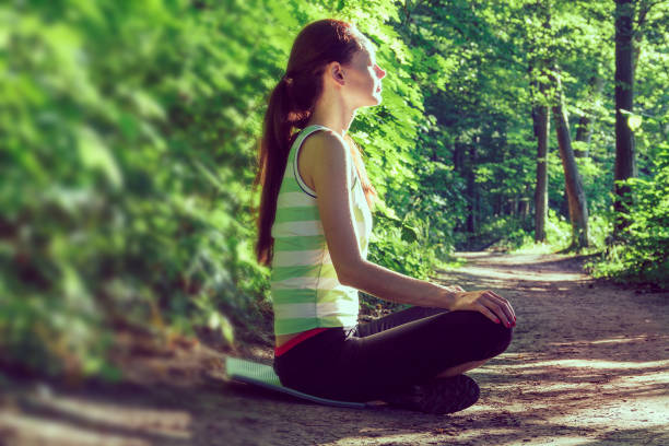 istock Woman Yoga - relax in nature 922663814