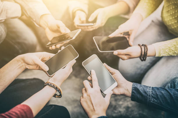 istock Friends having fun together with smartphones. 922664672