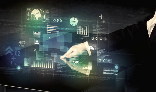 istock Businessman touching interactive modern desk with technology icons 922665960