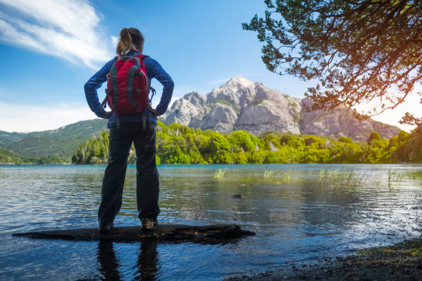 woman hiker enjoys view of the lake - bariloche patagonia argentina lake imagens e fotografias de stock