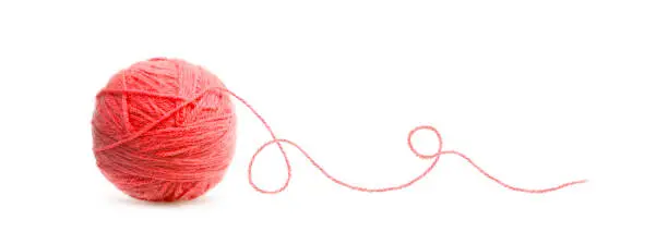 Red ball of Threads wool yarn isolated on white background