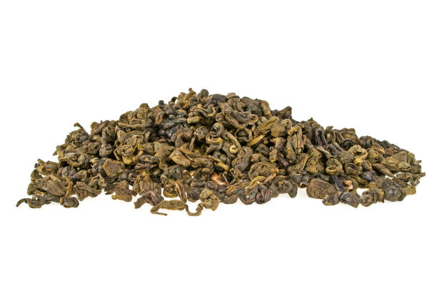 istock Heap of dry green tea isolated on white background 922670090