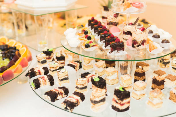 istock Delicious sweets on wedding candy buffet with desserts, cupcakes 922670092