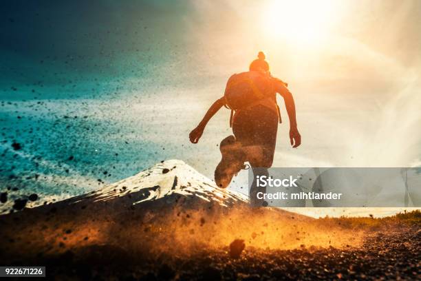 Woman Athlete Runs Stock Photo - Download Image Now - Running, Mountain, Cross-Country Running