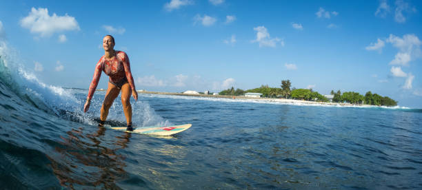 istock Surfer rides the clear ocean wave 922672088