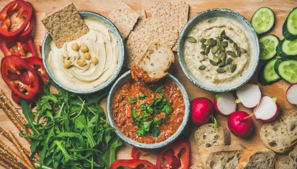istock Flat-lay of Vegetarian dips hummus, babaganush, muhammara 922673398