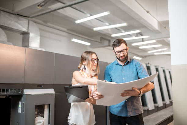 istock Woman with print operator at the manufacturing 922673864
