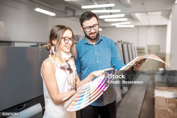 Woman With Print Operator At The Manufacturing Stock Photo - Download Image Now - Printing Plant, Printing Press, Color Swatch