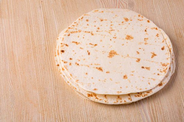 istock tortilla  on wooden table 922676514