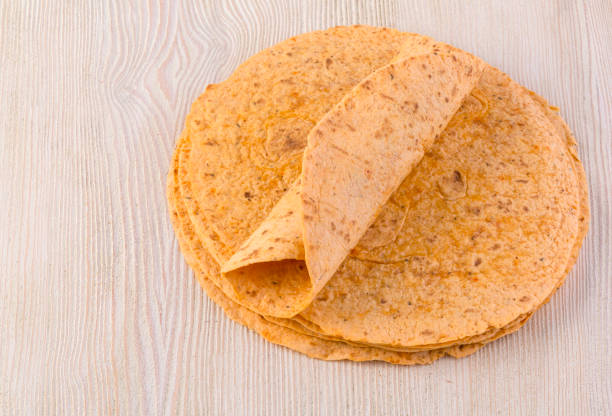 istock tortilla  on wooden table 922676606