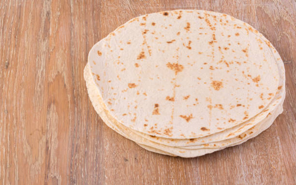 istock tortilla  on wooden table 922676616