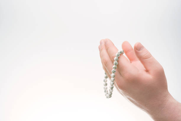 istock Hands with Muslim beads. Man praying 922677006