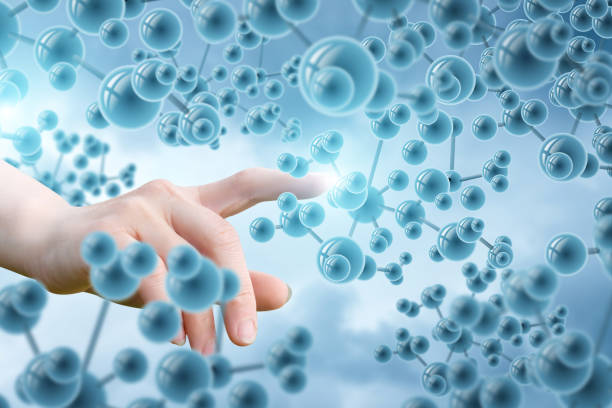 Hand touching the molecules . Hand touching the molecules on blurred background. high energy physics stock pictures, royalty-free photos & images