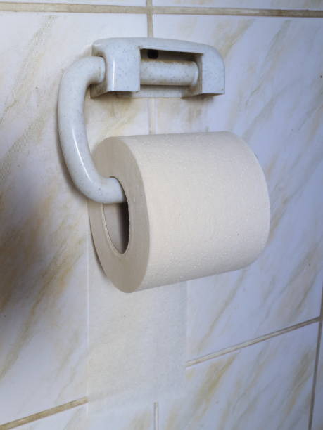 istock toilet paper on the wall 922678528