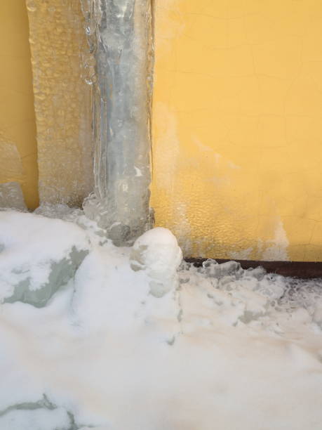 istock Gutter in the ice against a yellow wall 922679180