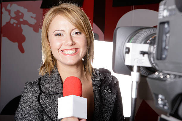 TV reporter ON THE AIR stock photo