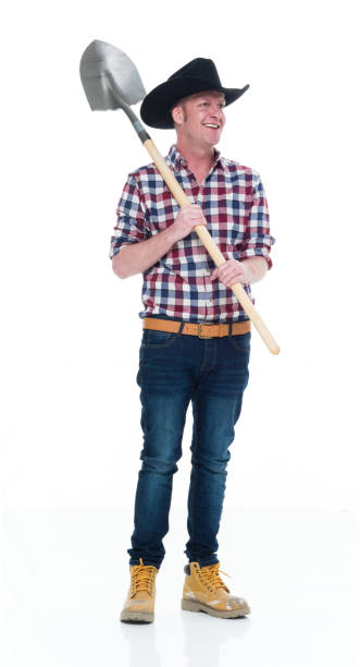 istock Farmer holding a shovel 922679324
