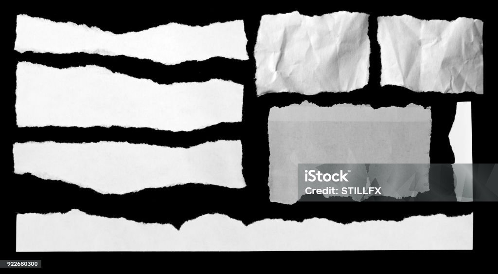 Torn papers on black Pieces of torn paper on black Cut Or Torn Paper Stock Photo