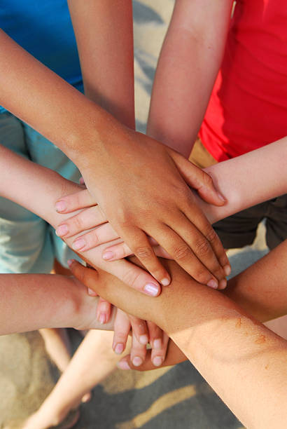 istock Group of friends holding hands showing team effort 92268057