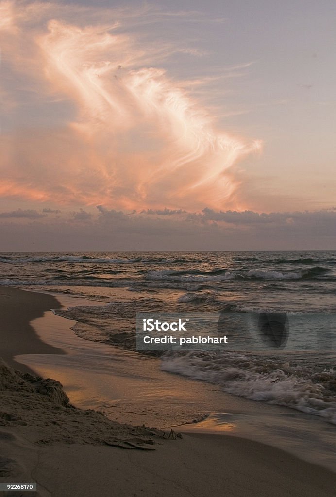 Sunset on the water - vertical  Beach Stock Photo