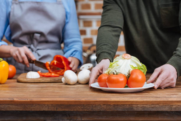 istock cropped image of couple preparing vegetables 922681910