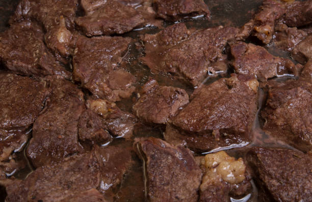 istock Meat beef fried pieces in the oven, close-up as background, texture 922682304