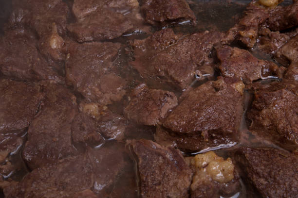 istock Meat beef fried pieces in the oven, close-up as background, texture 922682312
