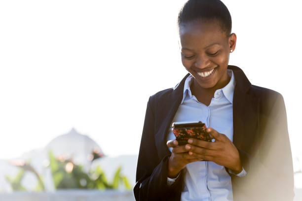 istock African business woman using a smart phone 922686528