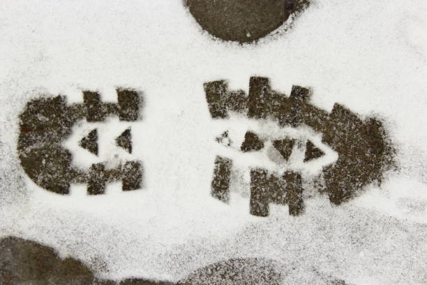istock Trace of shoe on a snow during the thaw. Approximation of spring. 922686896