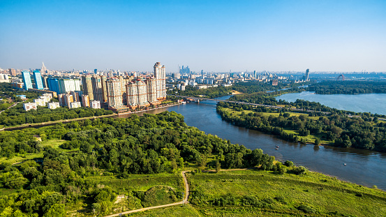 Aerial view of Moscow with Moskva River, Russia. Schukino district and Stroginsky bridge in Moscow. Scenic panorama of Moscow in the sunlight. Landscape and cityscape of Moscow.