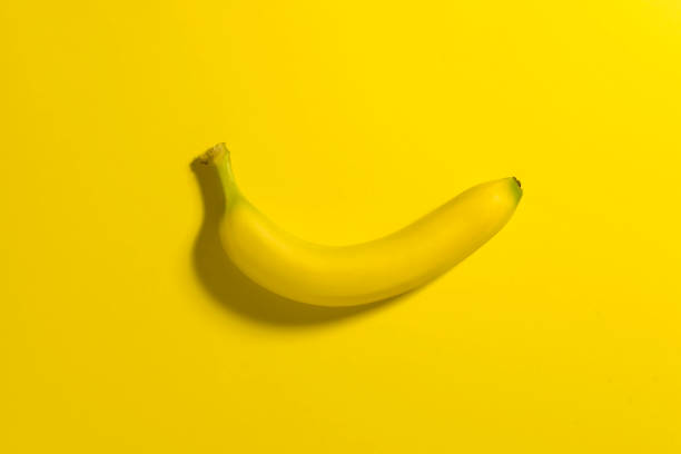 istock One banana on a yellow background. 922692090