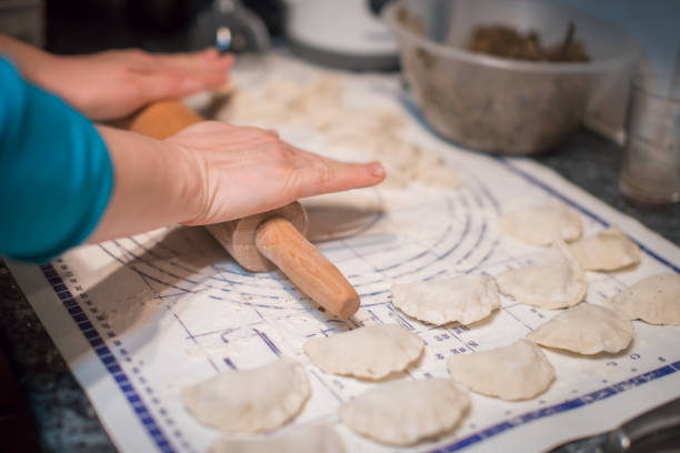 istock Woman preparing pierogi in the kitchen 922693262