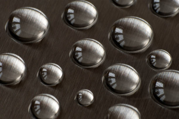 istock Drops of water on metal. Closeup. 922693410