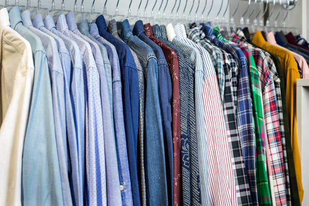 istock Clothes hang on a shelf in a store 922693746