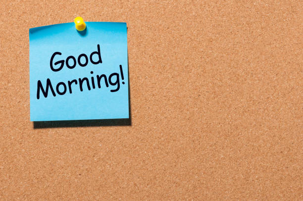 istock Good morning wishes in note pinned at office corkboard with empty space for text, mockup or template 922694168