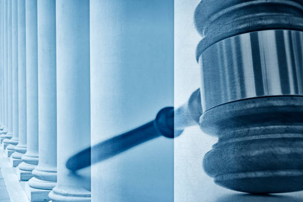 istock Multiple Exposure Of A Gavel And Greek Columns 922697186