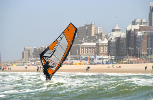 Langebaan, South Africa - 25 January 2014: Windsurfers and Kiteboarders in action on the water in the Langebaan Lagoon, South Africa.